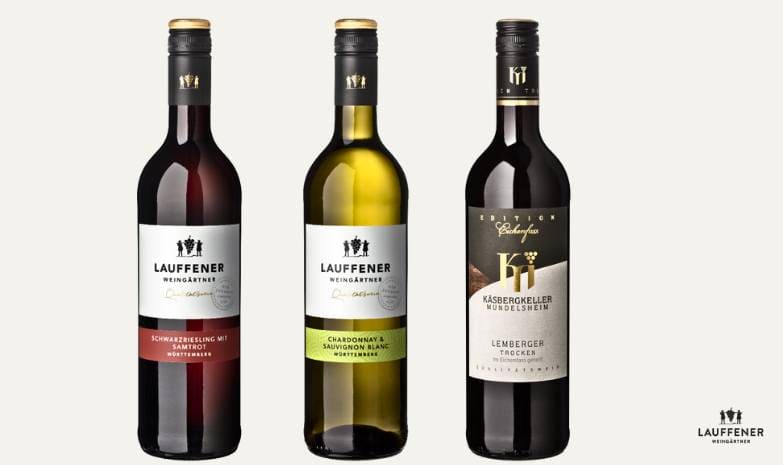 Unsere Wein-Burger-Edition enthält drei Weinsorten der Lauffener Weingärtner: eine Flasche Rotwein „Schwarzriesling mit Samtrot“, eine Flasche Weißwein „Chardonnay & Sauvignon Blanc“ und eine Flasche Rotwein „Lemberger Trocken“ aus der Edition Eichenfass.